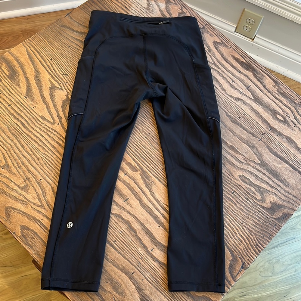 Lululemon black capri pants with side pockets size 4